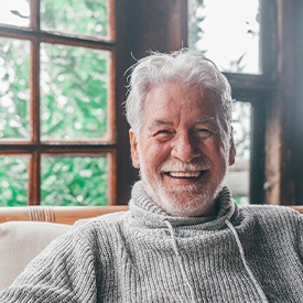 Closeup of senior man smiling at home