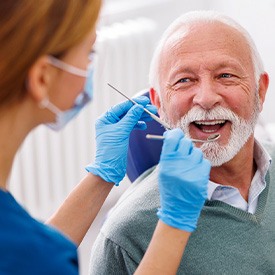 Mature man smiling during dental checkup